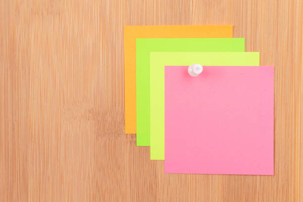 istock Colored Sticky Notes Pinned to the Wooden Message Board 1539951011