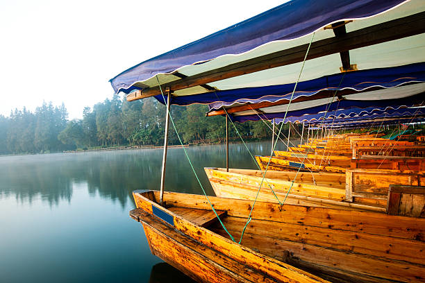 istock wooden boat in the river 153996896