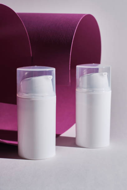 istock Container for cream, shampoo, toiletries, spa. Unbranded white plastic bottles. Bottle with a dispenser for cosmetic products. Skin care and beauty concept. Mockup style, copy space 1539977823