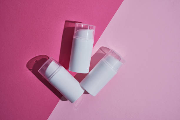 istock Container for cream, shampoo, toiletries, spa. Unbranded white plastic bottles. Bottle with a dispenser for cosmetic products. Skin care and beauty concept. Mockup style, copy space 1539978404