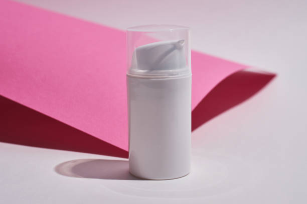 istock Container for cream, shampoo, toiletries, spa. Unbranded white plastic bottles. Bottle with a dispenser for cosmetic products. Skin care and beauty concept. Mockup style, copy space 1539979019