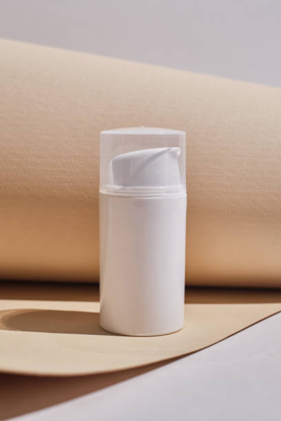 istock Container for cream, shampoo, toiletries, spa. Unbranded white plastic bottles. Bottle with a dispenser for cosmetic products. Skin care and beauty concept. Mockup style, copy space 1539979562