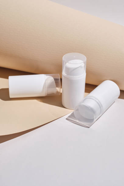 istock Container for cream, shampoo, toiletries, spa. Unbranded white plastic bottles. Bottle with a dispenser for cosmetic products. Skin care and beauty concept. Mockup style, copy space 1539979596