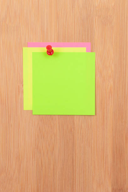istock Colored Sticky Notes Pinned to the Wooden Message Board 1539984374