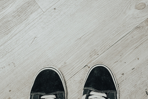 pair of shoes on the wood textured floor