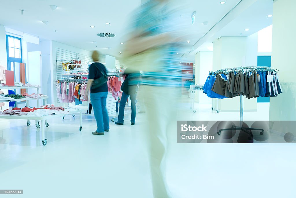 Women shopping in a clothing store, motion blur shopping in a clothing store, long exposure, motion blur Only Women Stock Photo