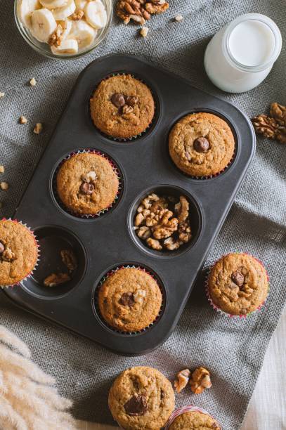istock Tray of freshly-baked muffins sits on a table. 1540016722