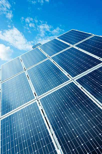 Solar Power Panels Against Blue Sky stock photo