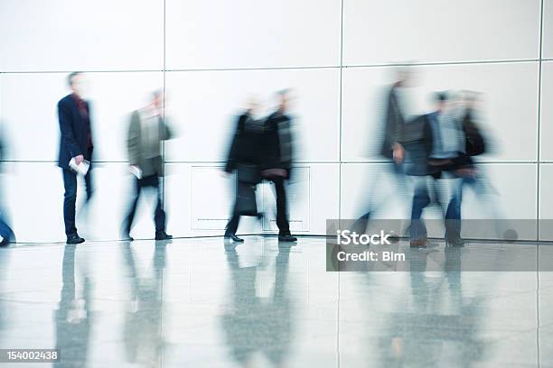Commuters Walking In Corridor Blurred Motion Stock Photo - Download Image Now - Office, People, Leaving