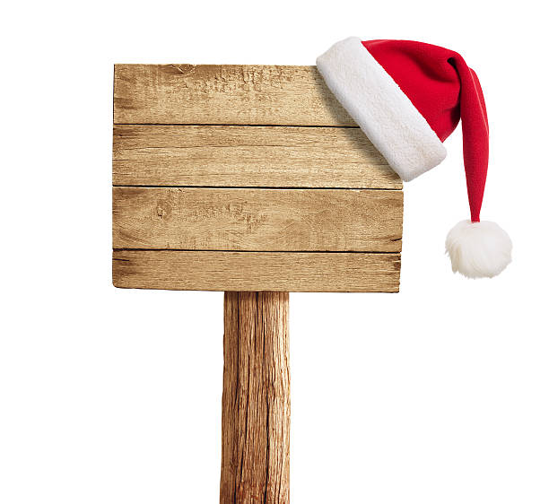 istock wooden signboard with Christmas hat isolated on white 154002663