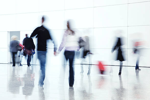 istock Blurred people walking toward a door in a hallway 154002779