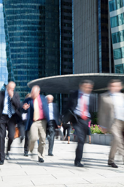 istock Blurred Businessmen Walking Outside Office Building, La Defense, Paris 154002943