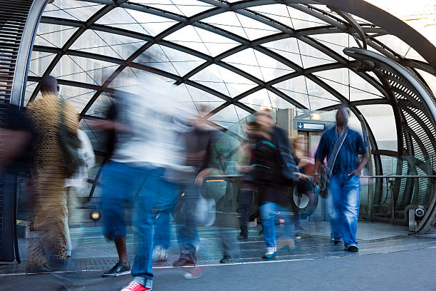 menge von pendlern verlassen der u-bahn-station - people speed mode of transport black and white stock-fotos und bilder