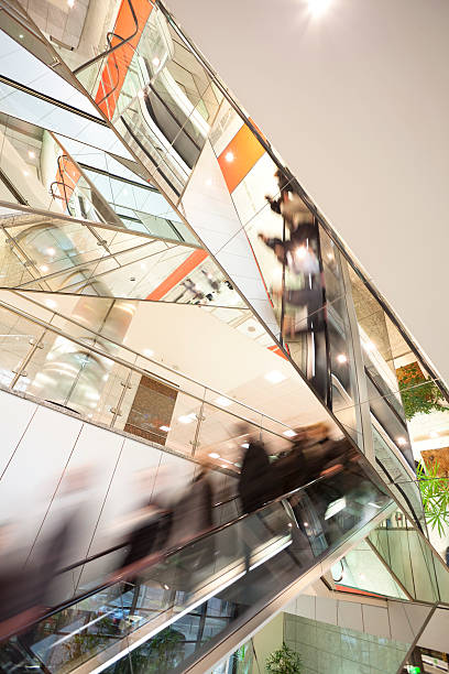 istock Blurred motion abstract of people on escalator 154003338
