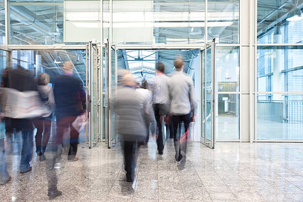 istock People Walking Through Entrance Door in Modern Building 154003339