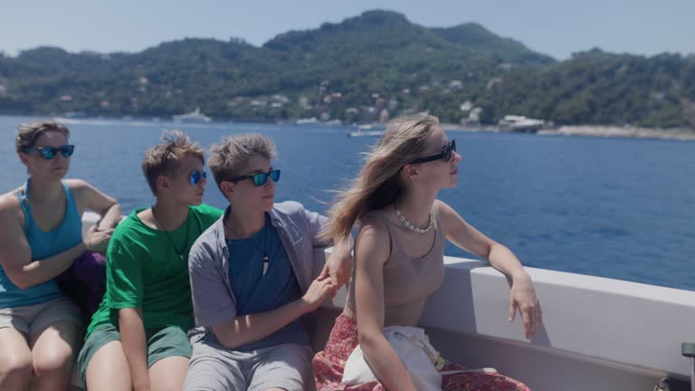 Tourists travelling by ferry in Liguria, Italy