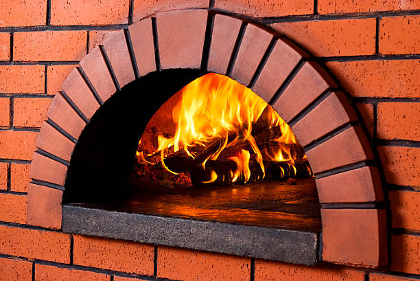 istock Close up of brick wood fired pizza oven 154006649