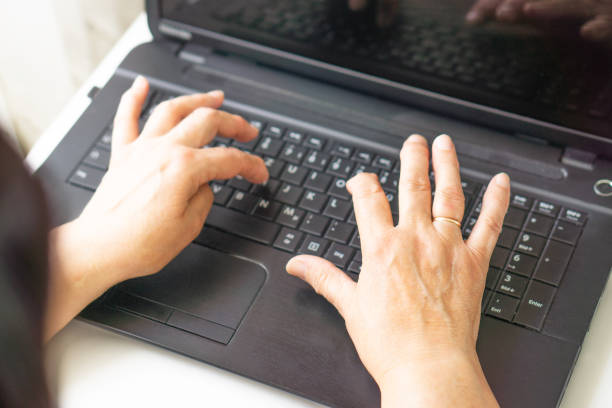 istock Female hands typing on a keyboard laptop computer. 1540066870