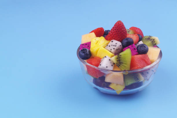 istock Fruit salad in glass bowl with copy space 1540078582