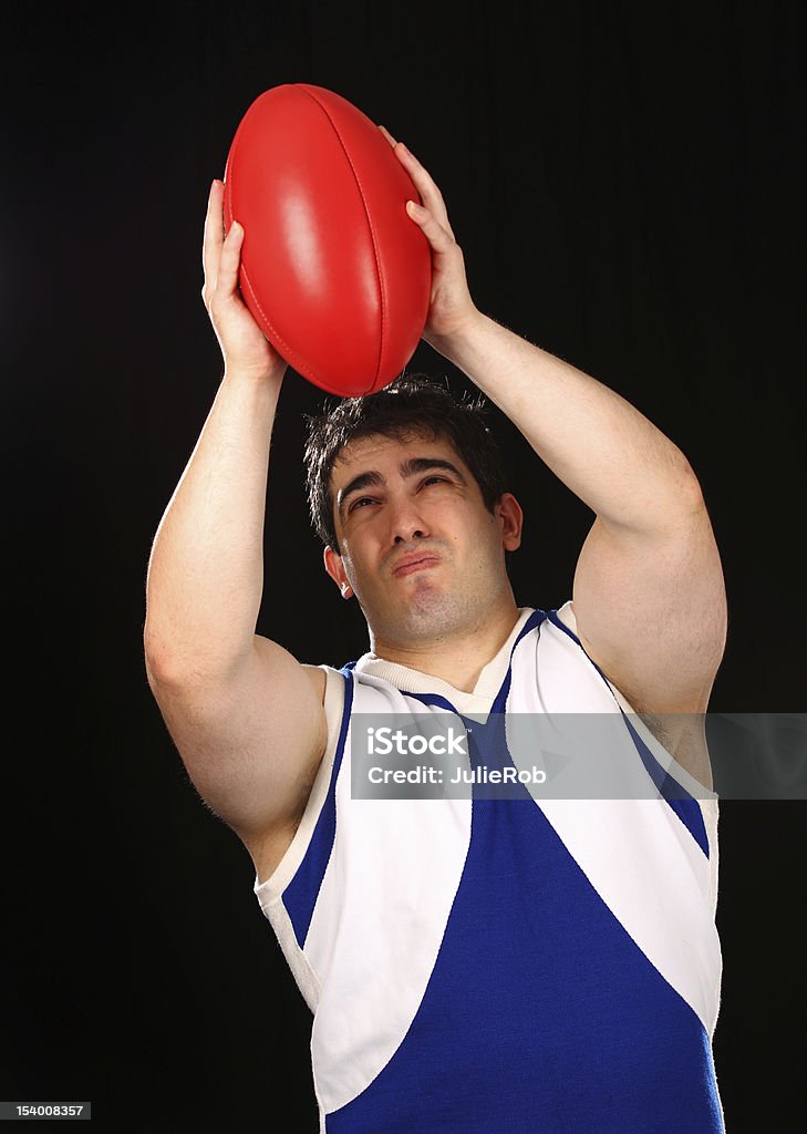 AFL-Football-Spieler den ball erinnert - Lizenzfrei Australian Football Stock-Foto