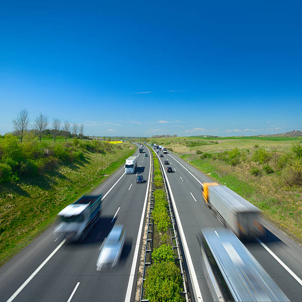 istock Trucks and Cars Driving on Motorway 154009492