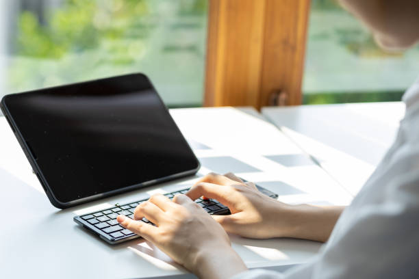 istock Young woman working with tablet at home office. 1540112972