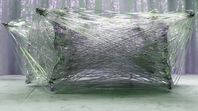 Diamond people entangled in a transparent plastic web dance in a circle. Web. 3d animation of a seamless loop.