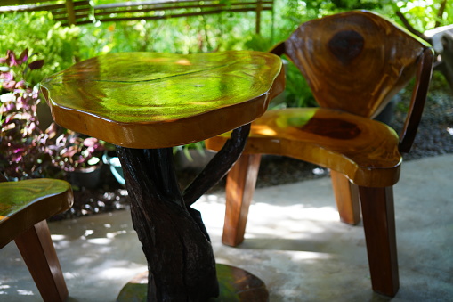 Wooden table and chair with wooden chair stump