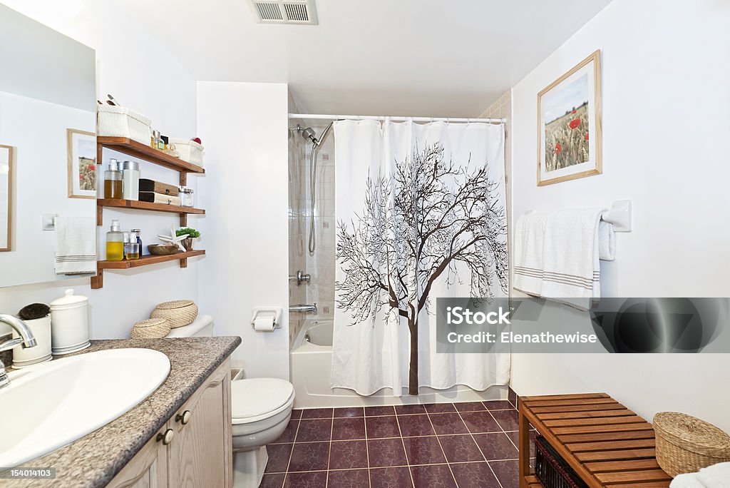 Clean white bathroom with red floors and wood accents Interior three piece bathroom - artwork on wall from photographer portfolio Shower Curtain Stock Photo
