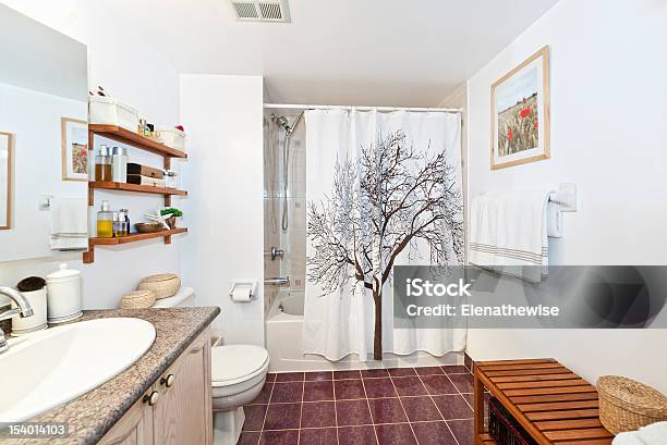 Clean White Bathroom With Red Floors And Wood Accents Stock Photo - Download Image Now