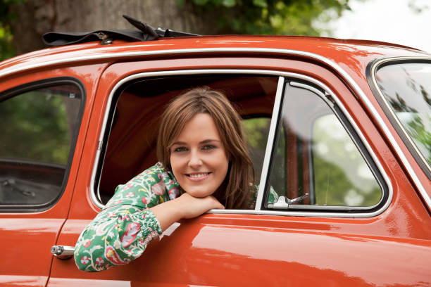 istock Young woman smiling in Car 154014515