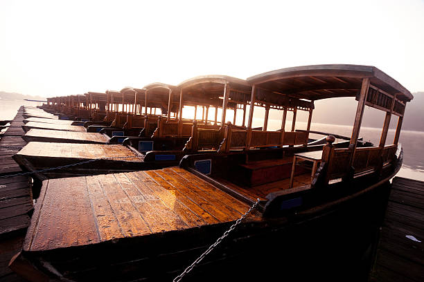 istock wooden boat in the river 154015706