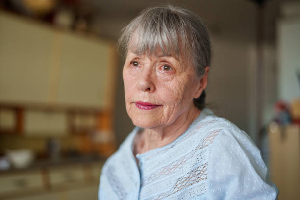 istock Senior woman with a sad look on face standing in kitchen 1540160561