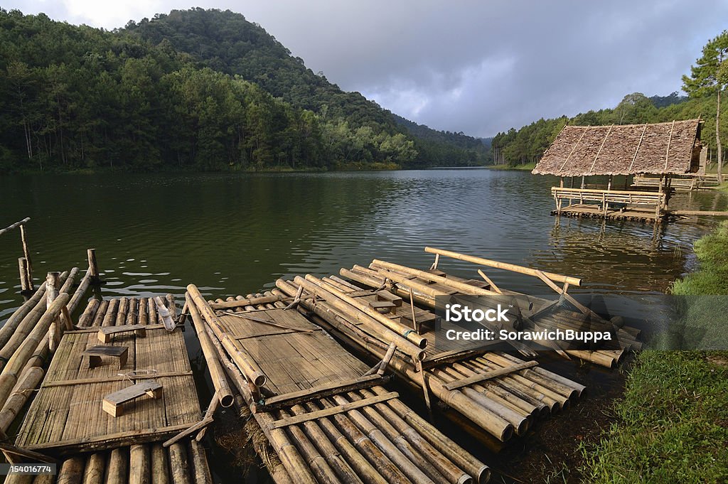 Bamboo Raft and cottages on the water Bamboo Raft and cottages on the water at Pang-Ung, Mae-Hong-Son, northern part of Thailand. Beauty In Nature Stock Photo