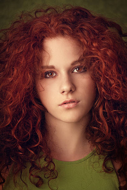 portrait of a curly red haired beauty