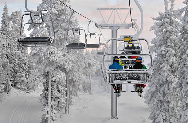 istock Ski chair lift with skiers 154019217
