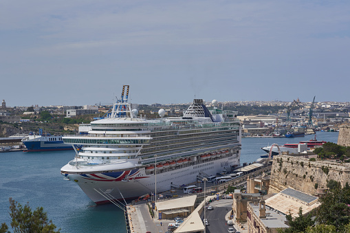 The M.S. Carnival Liberty, owned by Carnival Cruise Lines, is docked on Grand Turk in the Turk and Caicos Islands. Passengers enjoy the beach. (October 2014)