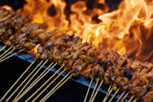 Sizzling street food satay at a street food market in Malaysia