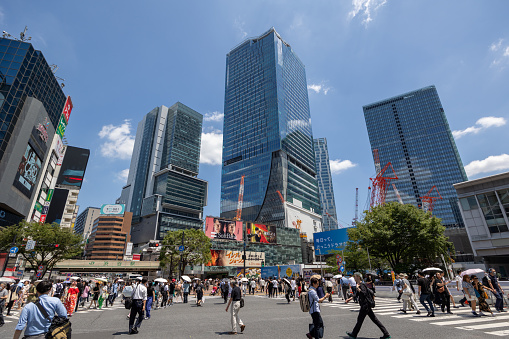 Tokyo, Japan - June 29, 2023 : People at Shibuya District, Tokyo, Japan. It is a famous shopping district in Tokyo. Many shopping malls, restaurants, and game centers are located in this district.