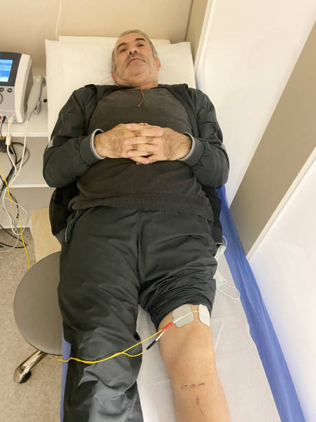 istock Old man getting physical therapy in hospital 1540208759