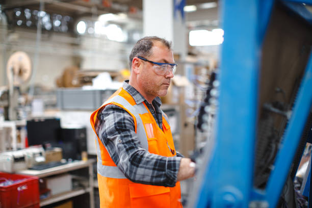 istock Manual worker man working at manufacturing factory 1540211987