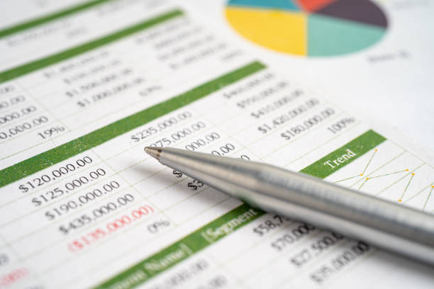 istock Pen on chart or graph paper. Financial, account, statistics and business data concept. 1540219839