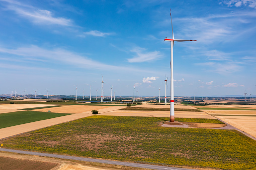 Wind turbines in an arid landscape. An alternative way of generating electricity from the wind. Innovative technologies for the future with zero emissions. Copy space.