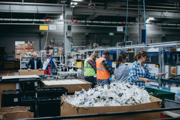 istock Manuel workers team work on production line with screw tool at factory 1540237021