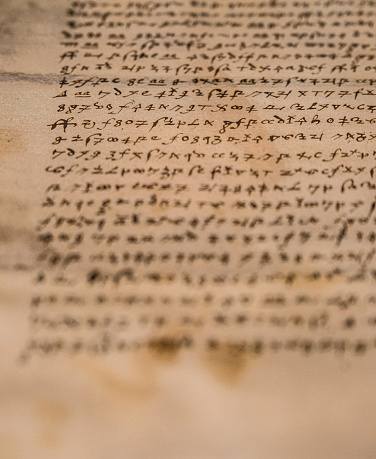 Elizabethan encoded text with an encryption cypher in a letter.