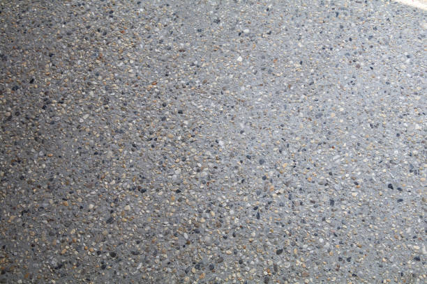 istock Concrete cement work with small gravel lowering garage pump worker 1540245089