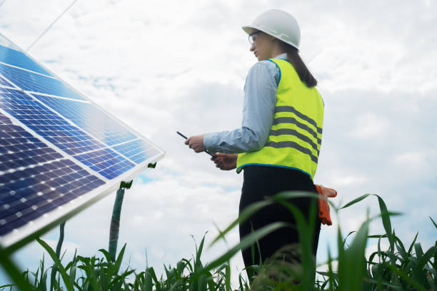 istock Portrait of a technical engineer with a tablet in his hands, standing in front of an unfinished tall outdoor solar panel of a photovoltaic system, technical engineer girl 1540255696