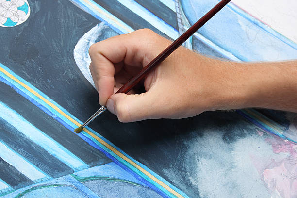 istock man hand painting blue abstract picture 154027833