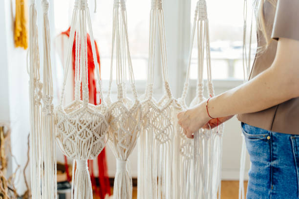 istock Close up of unrecognizable women's hands hobby knitting handmade macrame. Creative knitting concept 1540291221