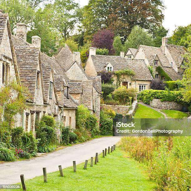 Houses Along A Small Road In Bibury Stock Photo - Download Image Now - Arlington Row, Bibury, Cotswolds